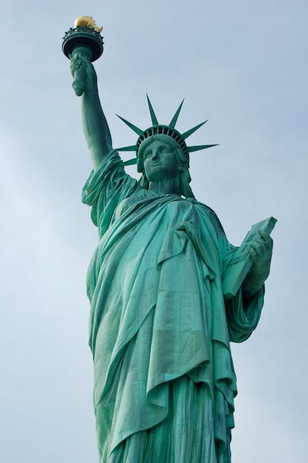 People collaborating around a table with documents and a laptop